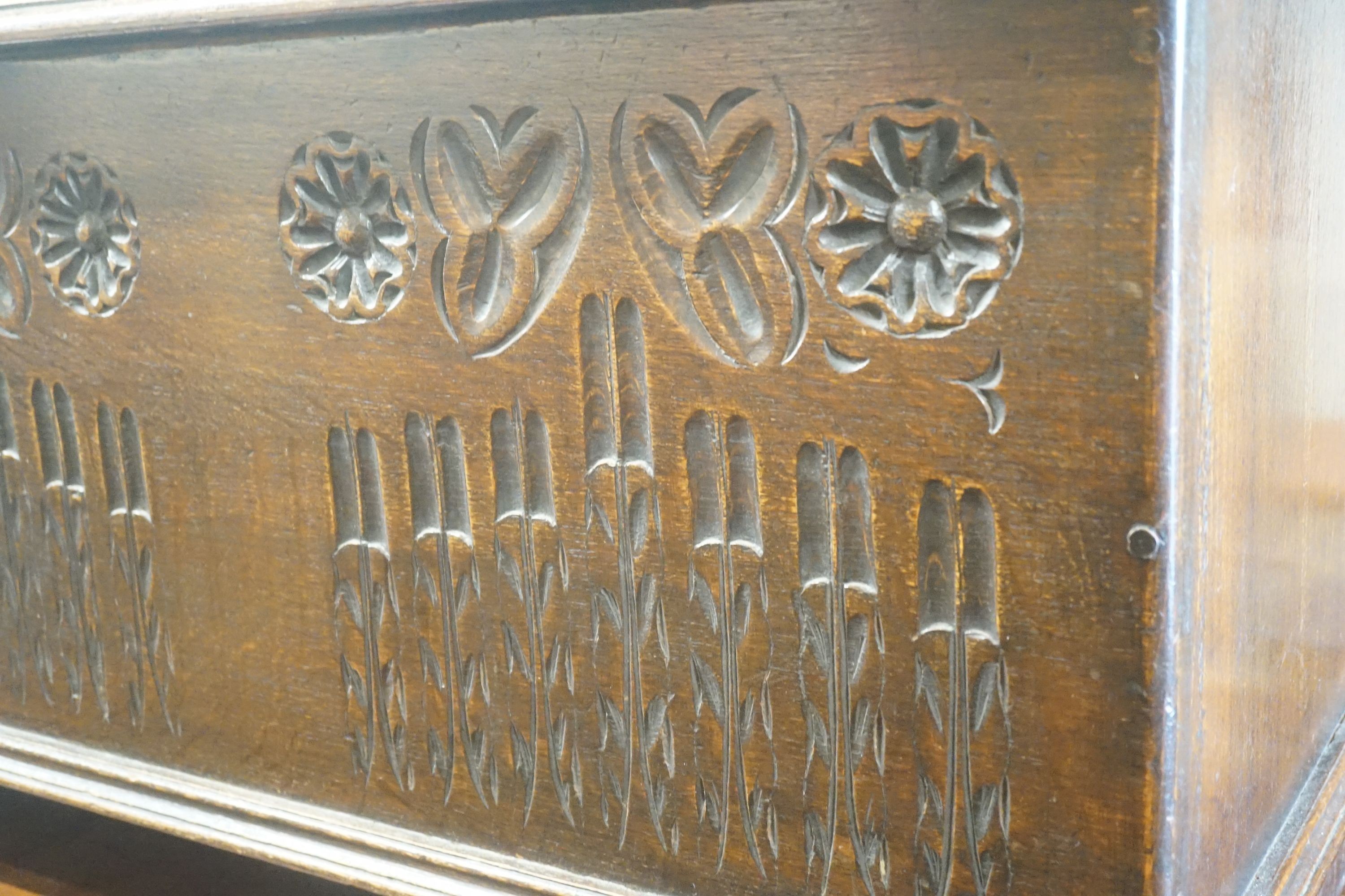 A small 17th century style carved country oak coffer, width 91cm depth 40cm height 47cm